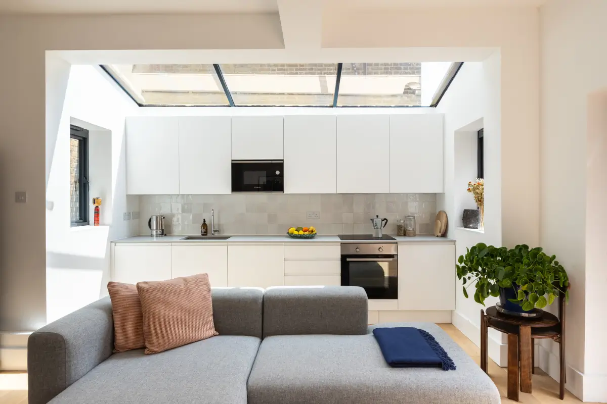 A Modern Extension and Period Details in a Ground Floor London Home 4 extended living space white kitchen