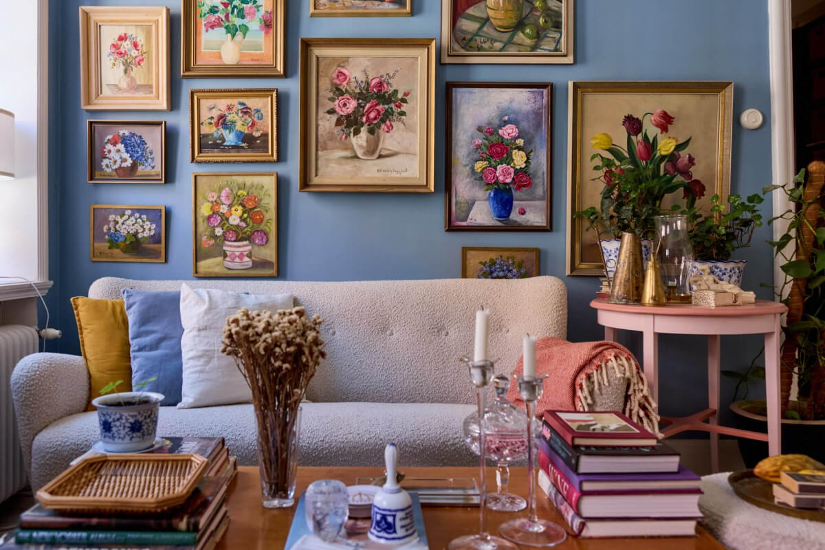 A Blue Living Room Filled with Art in a Swedish Apartment 4 floral gallery wall blue living room