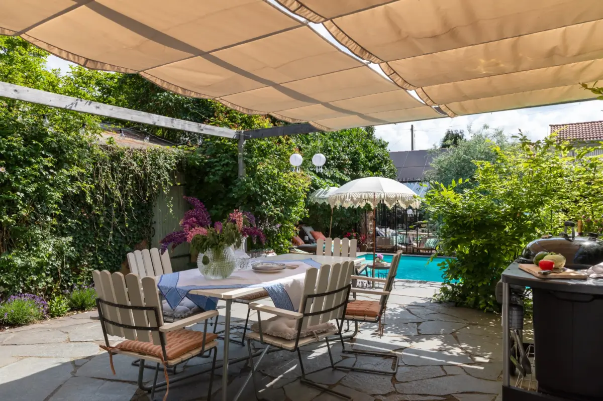 A Renovated 1920s Villa with a Spectacular Garden 39 garden dining area