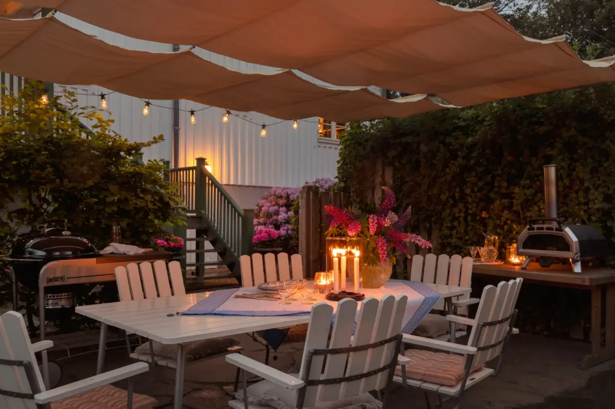 A Renovated 1920s Villa with a Spectacular Garden 40 garden dining table 1 A Renovated 1920s Villa with a Spectacular Garden