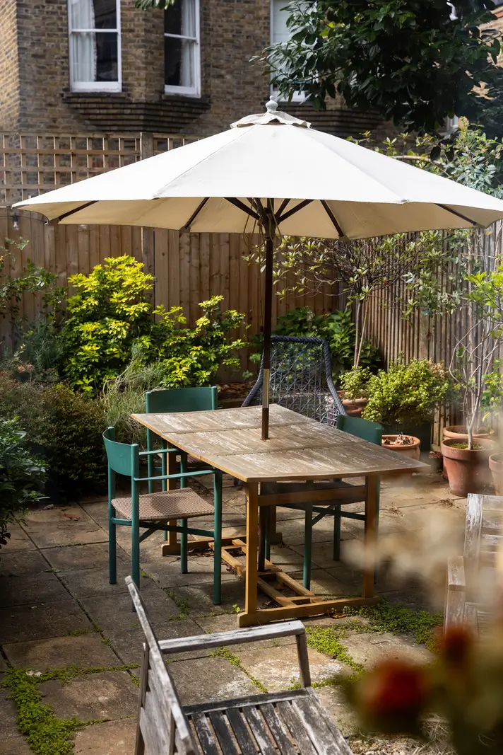 A Modern Extension and Period Details in a Ground Floor London Home 8 garden table