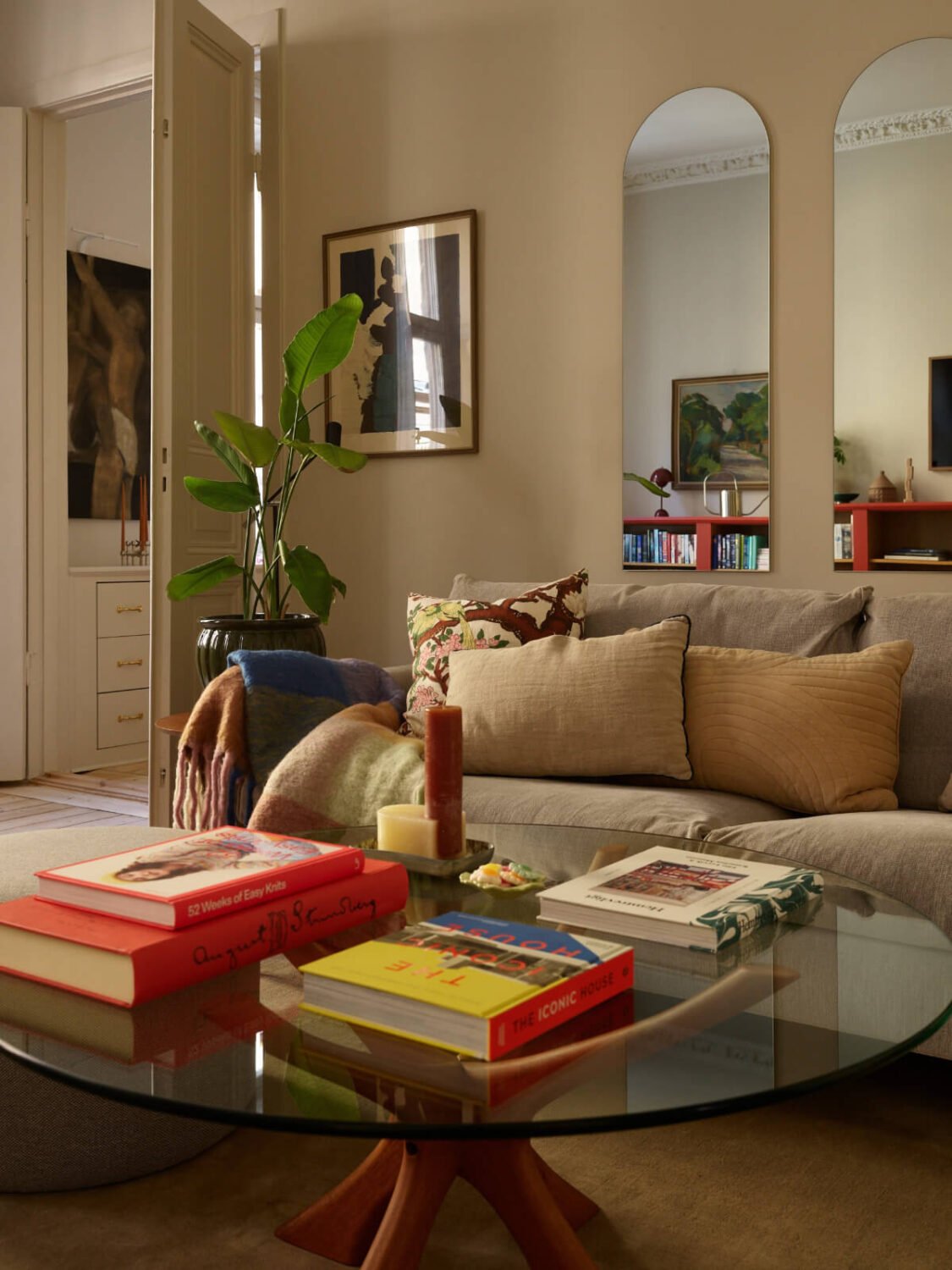 Blue and Red Color Accents in a Stylish Scandinavian Apartment 5 glass coffee table