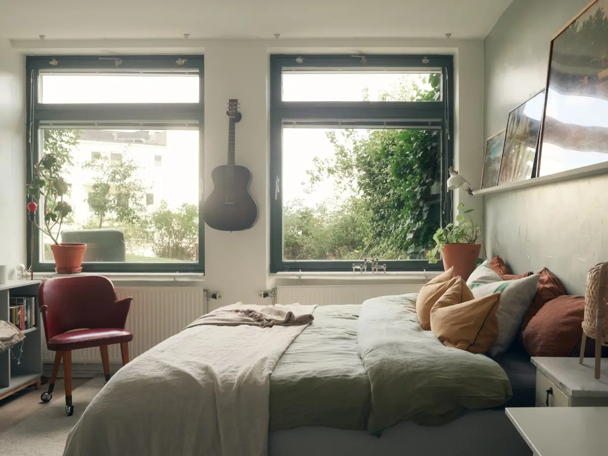 Industrial Elements in a 1960s Duplex Apartment in Stockholm 13 gray bedroom large windows