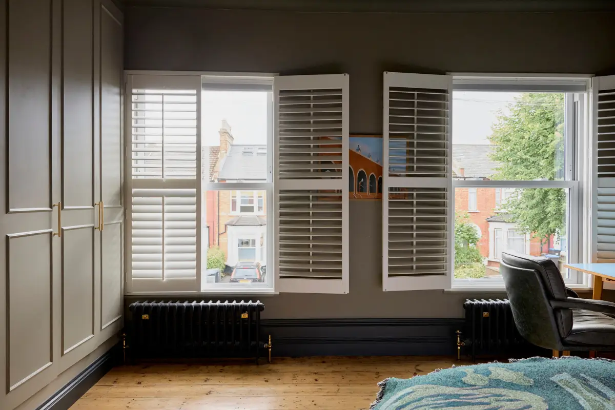 A Victorian Home with a Rich Color Palette and a Lush Garden 15 gray bedroom window shutters