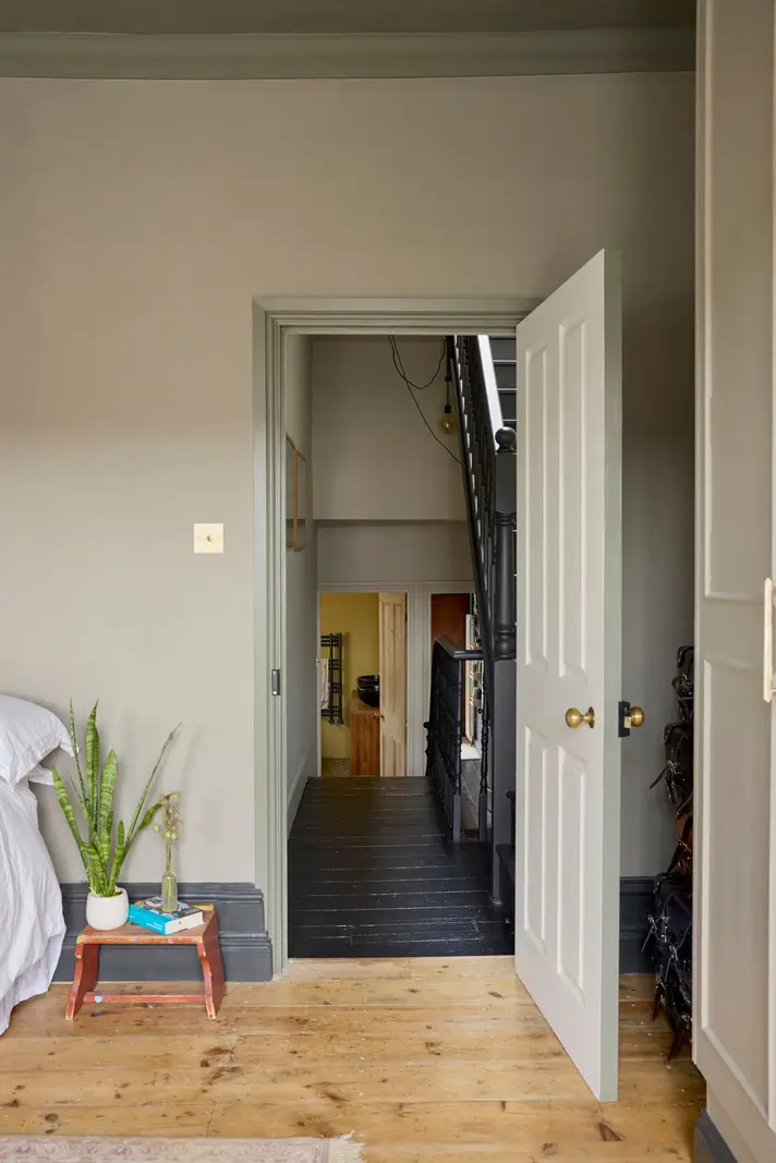 A Victorian Home with a Rich Color Palette and a Lush Garden 16 gray bedroom wooden floorboards