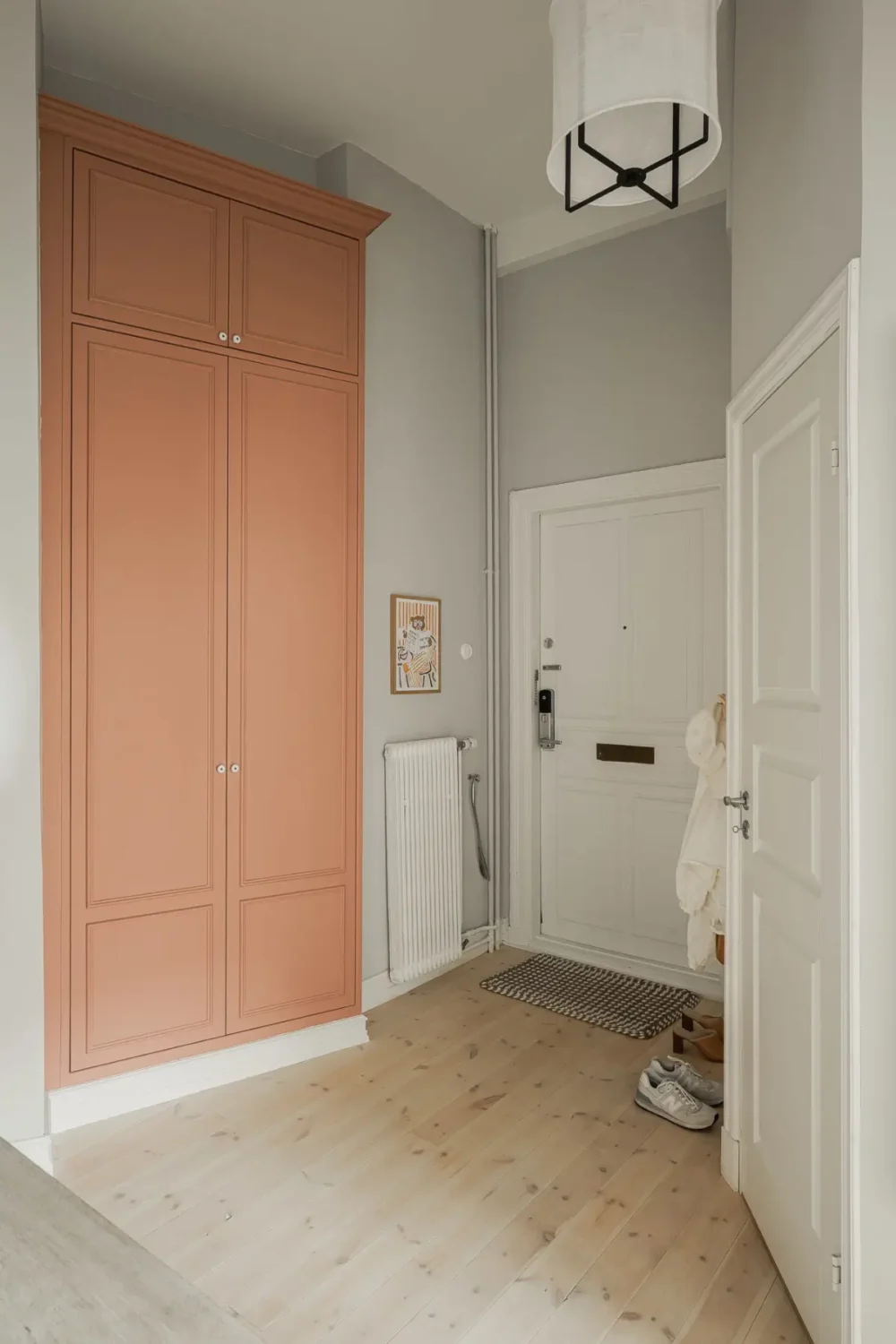 A Gray Scandinavian Apartment with a Royal History 25 gray hall terracotta built in wardrobes nordroom A Gray Scandinavian Apartment with a Royal History