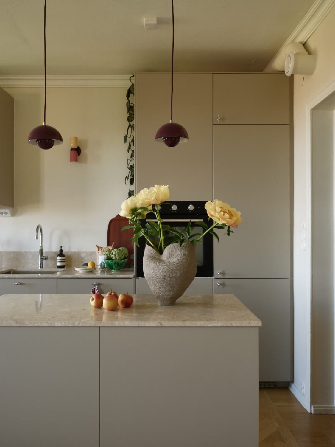 A Stockholm Apartment with a Butter-Yellow Bedroom 10 gray kitchen with island