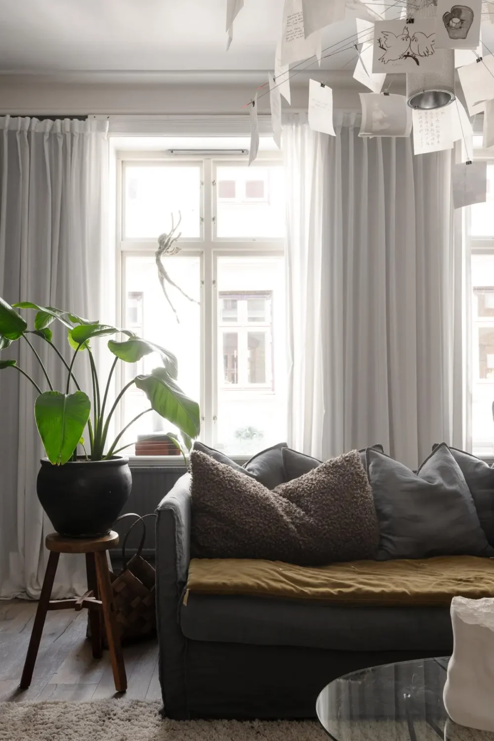 A Dark Gray Swedish Apartment with an Olive Green Kitchen 11 gray living room large windows