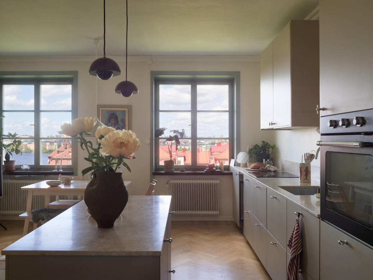 A Stockholm Apartment with a Butter-Yellow Bedroom 6 gray scandinavian kitchen large windows