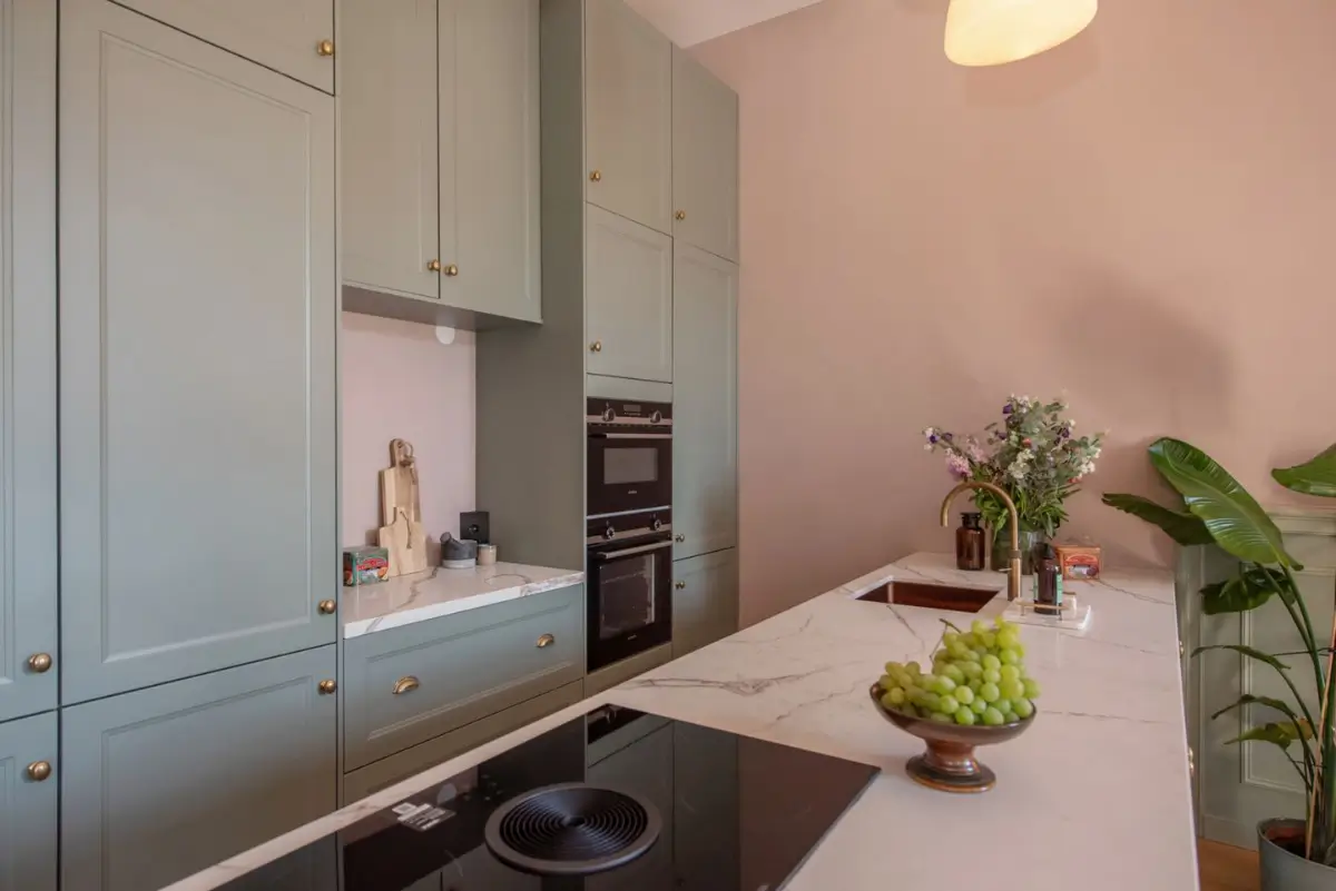 Art Nouveau Elegance Meets Modern Living in a Pink & Green Apartment 14 green and pink kitchen