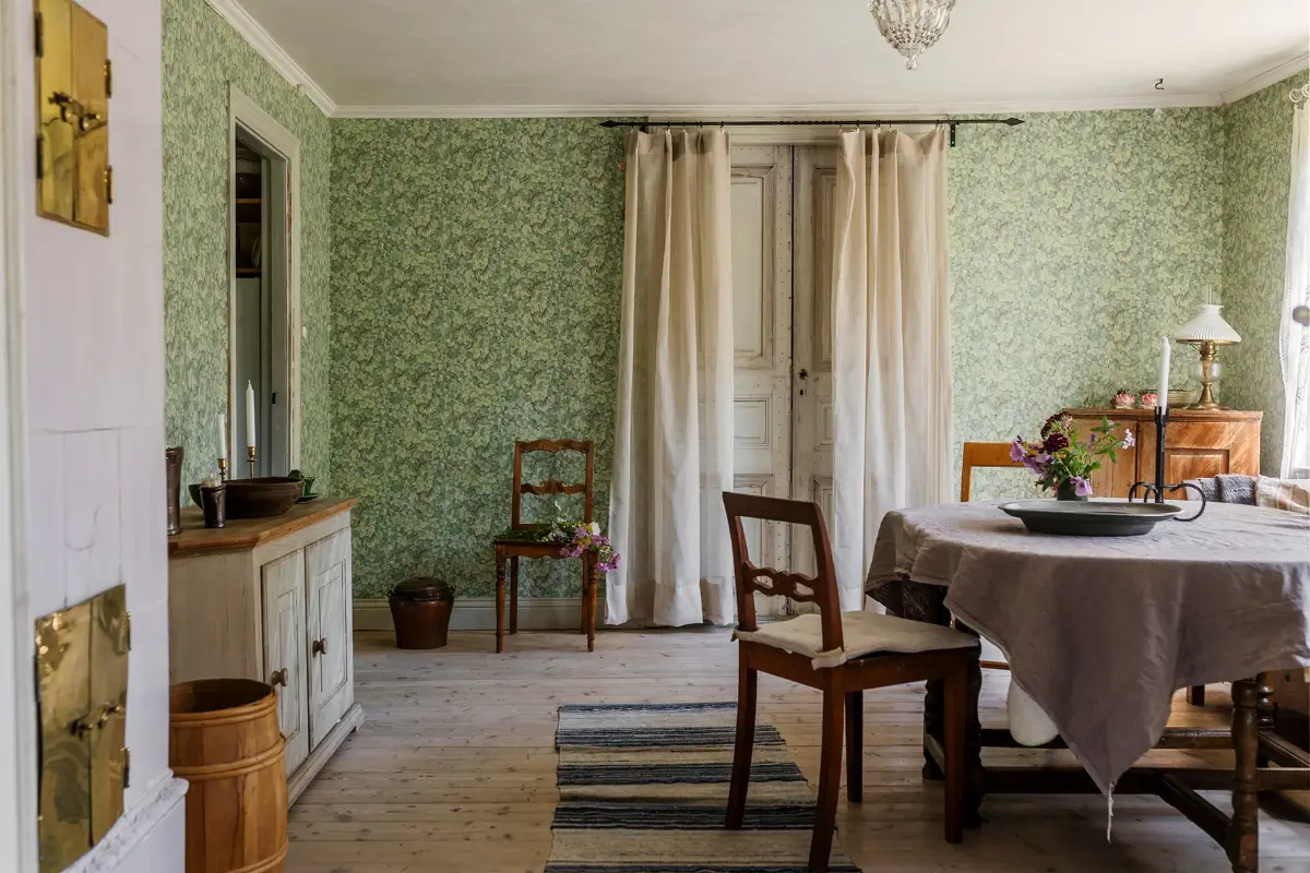 A Historic Lakeside Summer House in the Stockholm Archipelago 3 green dining room wooden doors