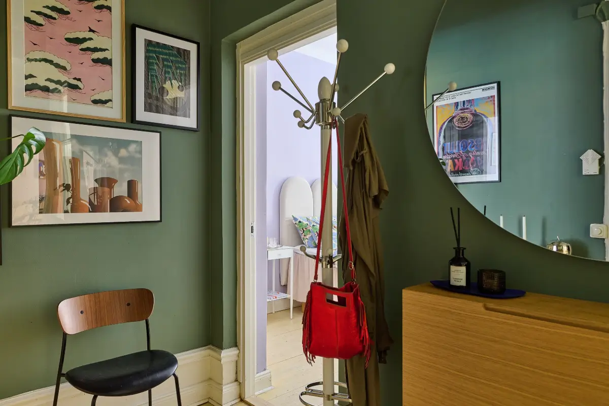 A Colorful Stockholm Apartment with a Large Terrace 21 green hall round mirror