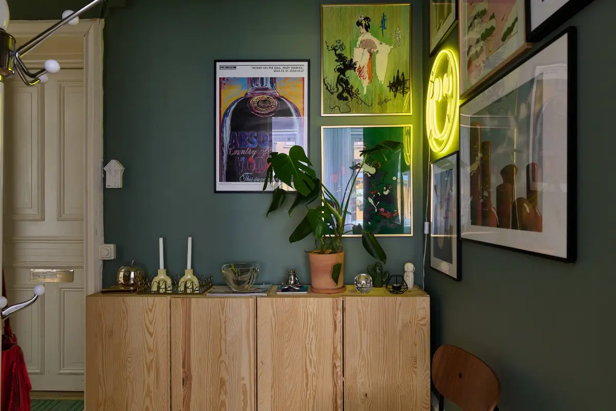 A Colorful Stockholm Apartment with a Large Terrace 20 green hall with art and ikea ivar cabinets