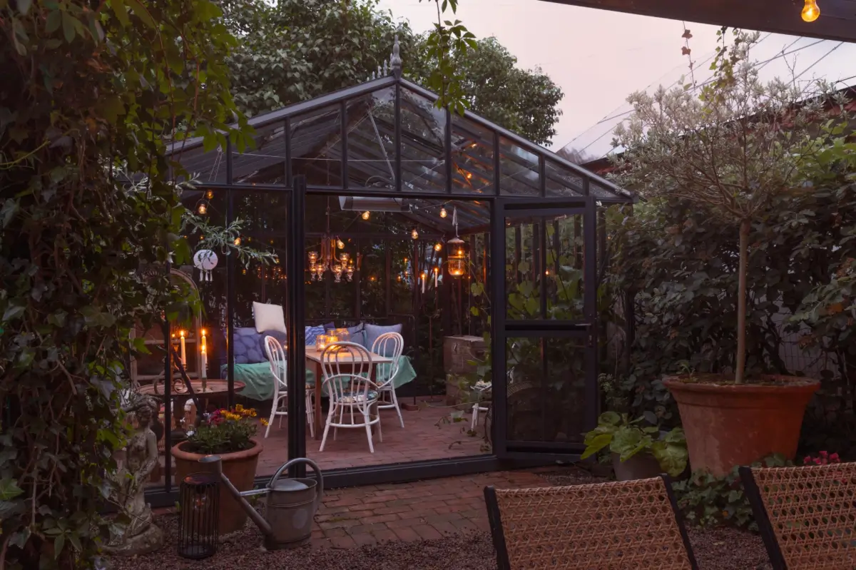 A Renovated 1920s Villa with a Spectacular Garden 42 green house at night