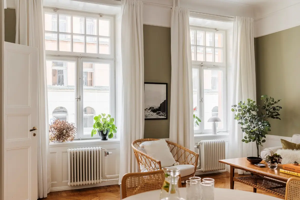 A Farrow & Ball Palette in an Art Nouveau Stockholm Apartment 3 green living room large windows
