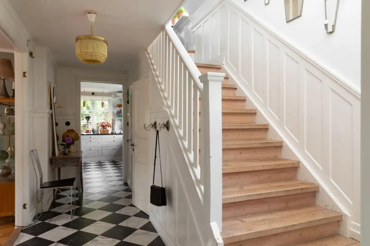 A Renovated 1920s Villa with a Spectacular Garden 4 hall checkerboard floor wooden stair