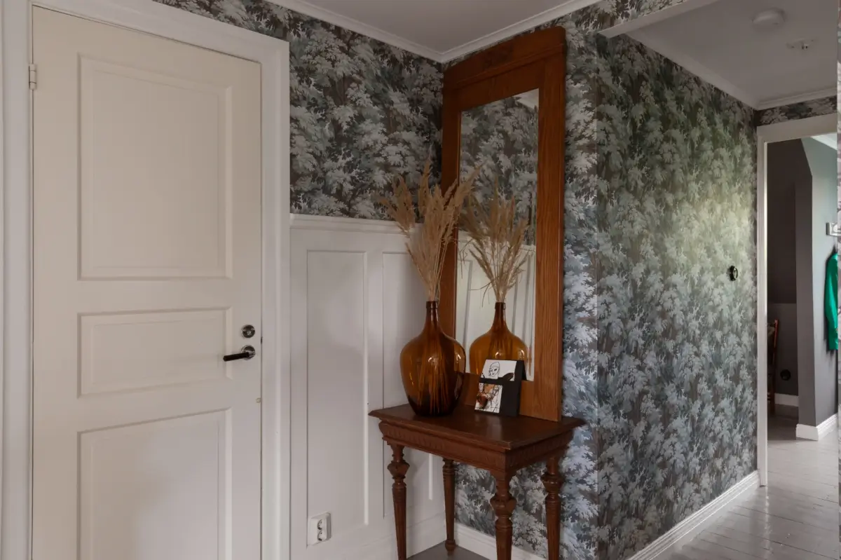 A Renovated 1920s Villa with a Spectacular Garden 33 hall dark wallpaper