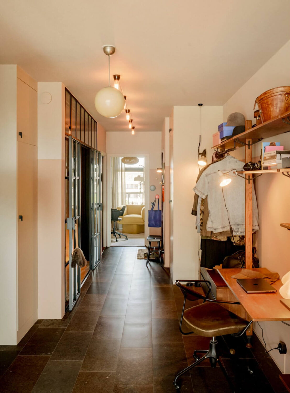 A Modern Swedish Apartment with Half-Painted Pink Walls 14 hall stone floor