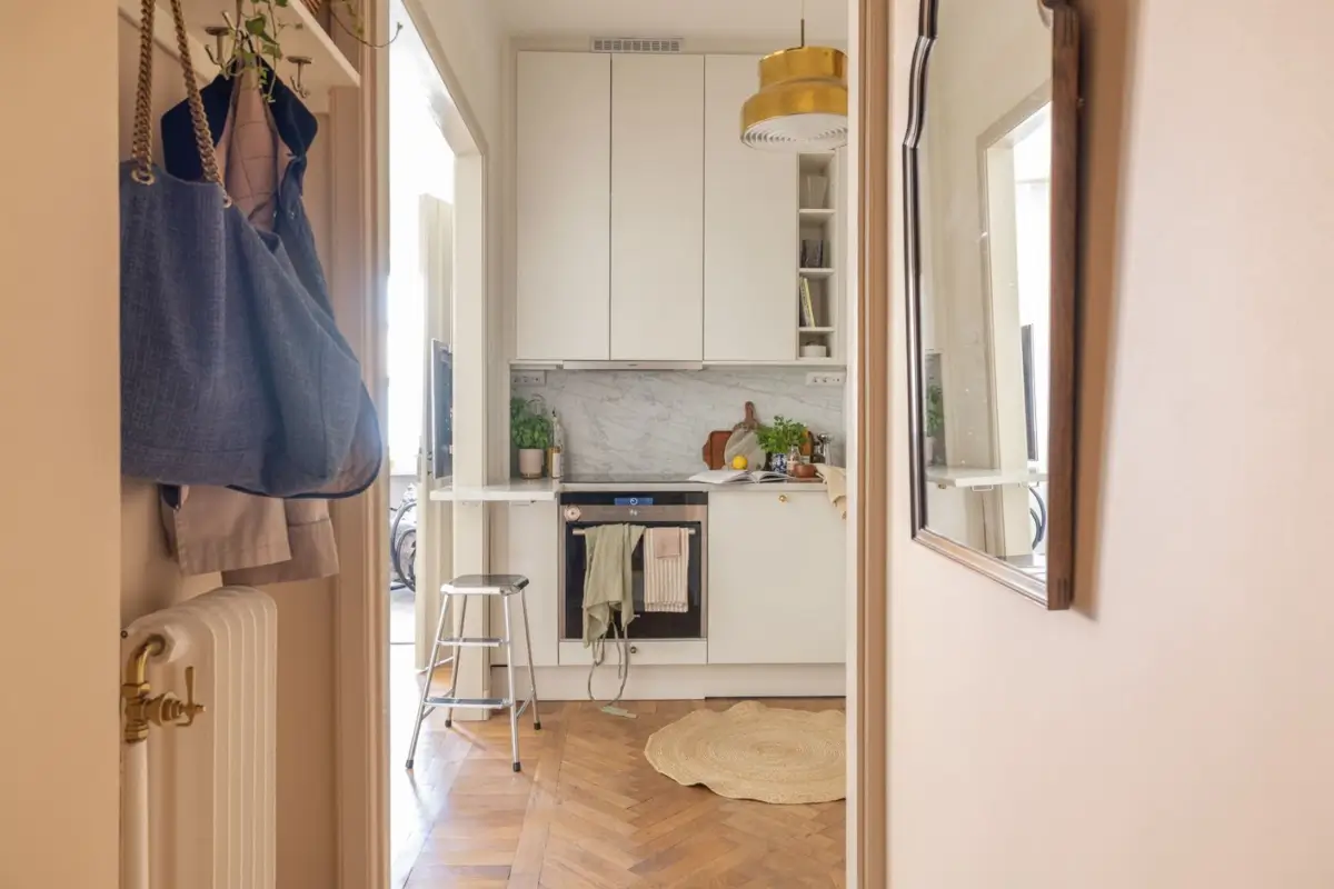 A Small Beige Stockholm Apartment with Plenty of Storage 15 hall view into kitchen