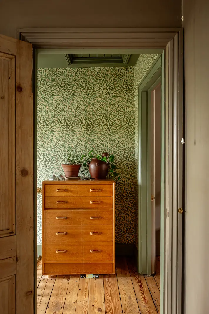 A Muted Color Palette and Original Details in a Victorian Terrace House 11 hall william morris wallpaper
