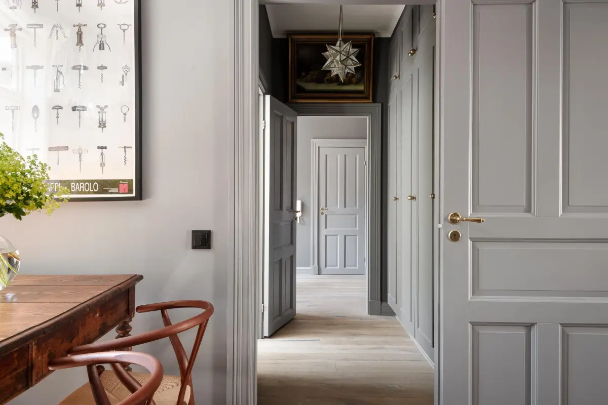A Dark Gray Swedish Apartment with an Olive Green Kitchen 8 hall with floor-to-ceiling wardrobes
