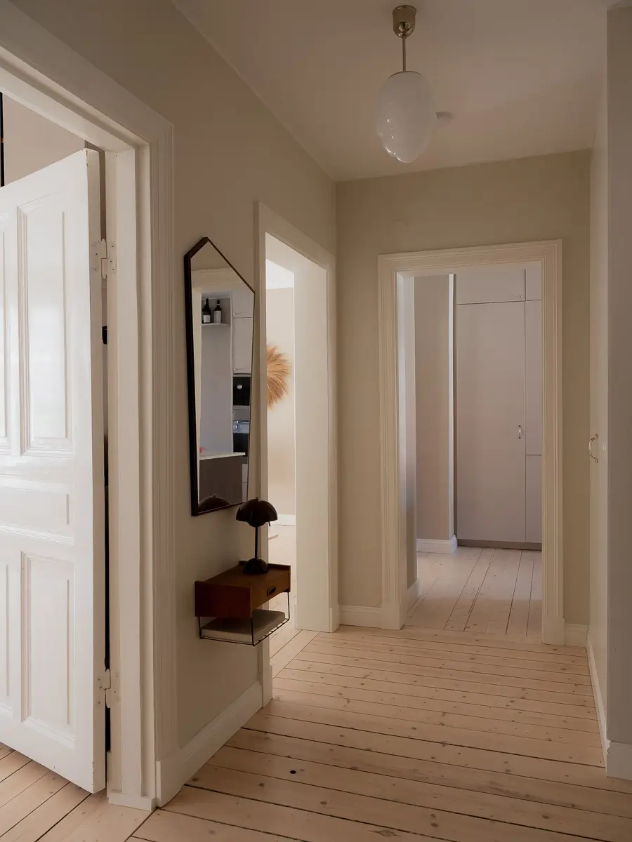 Neutral Shades and Period Elements in a Scandi Apartment 24 hall wooden floor