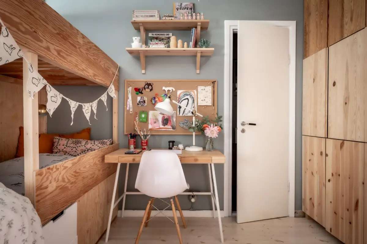 An Earthy Color Palette and Exposed Brick in a 1940s Apartment 24 kids bedroom ikea desk wooden wardrobes