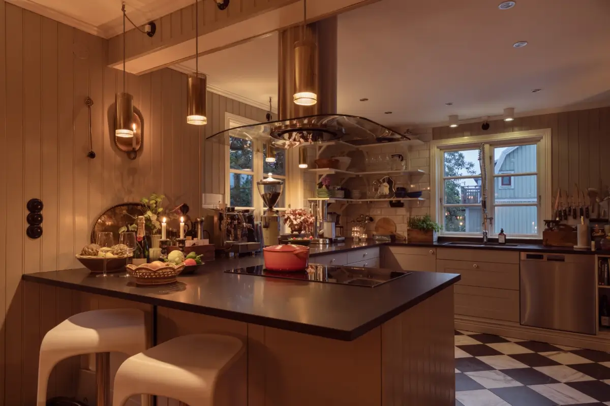 A Renovated 1920s Villa with a Spectacular Garden 9 kitchen at night checkerboard floor