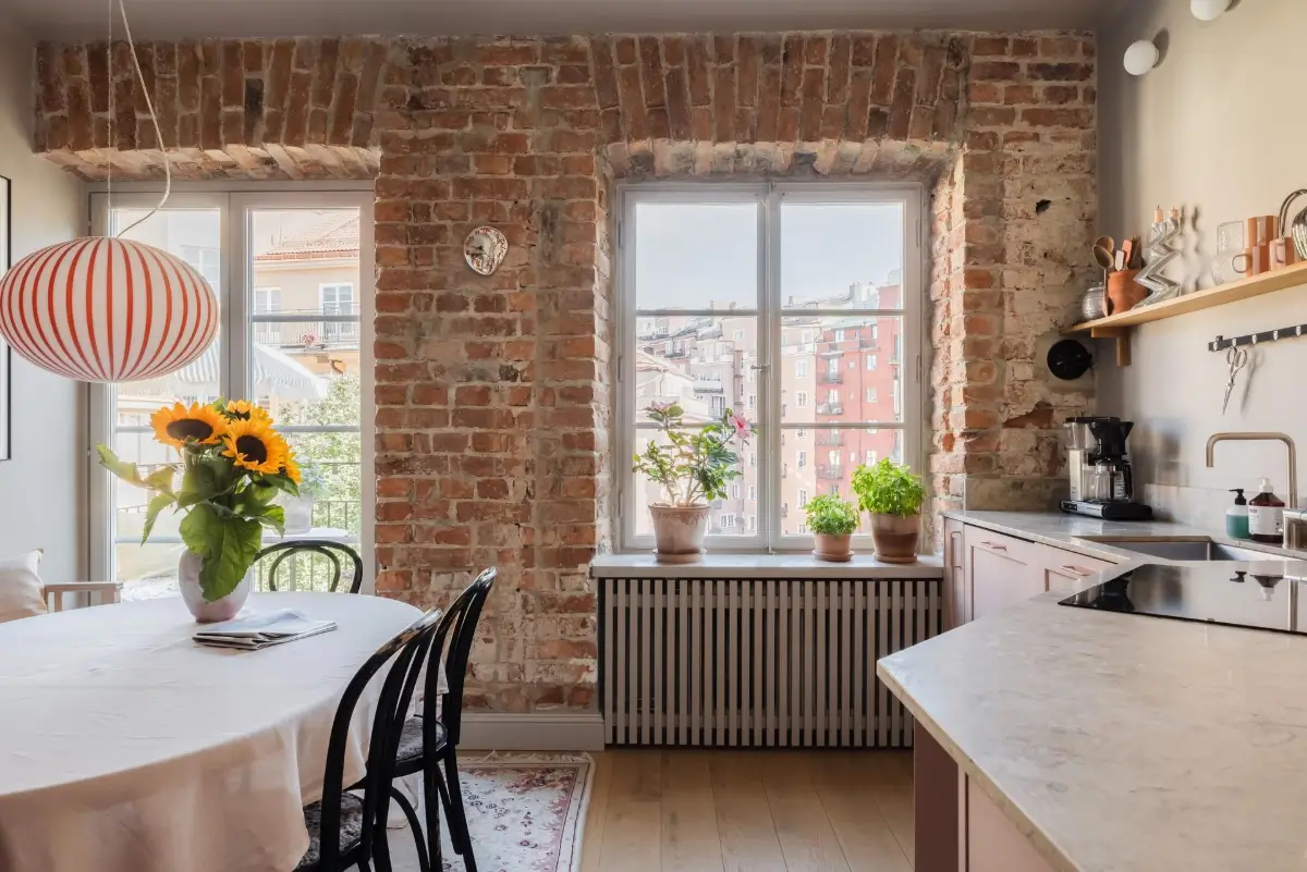 Colorful Rooms in a Practical Stockholm Family Apartment 2 kitchen exposed brick wall