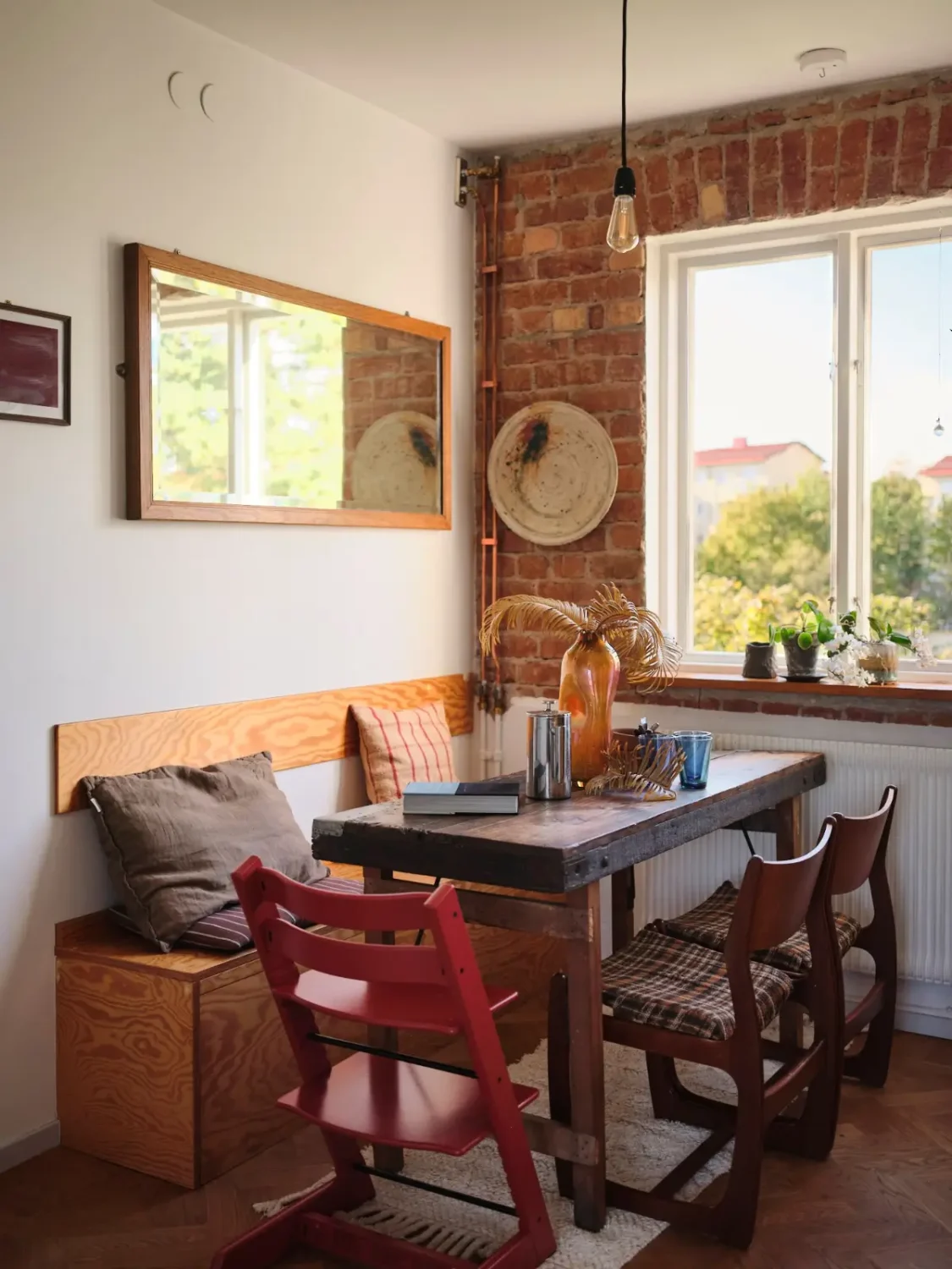 A Pink Bathroom and a Plywood Kitchen in a Stockholm Apartment 9 kitchen table with bench