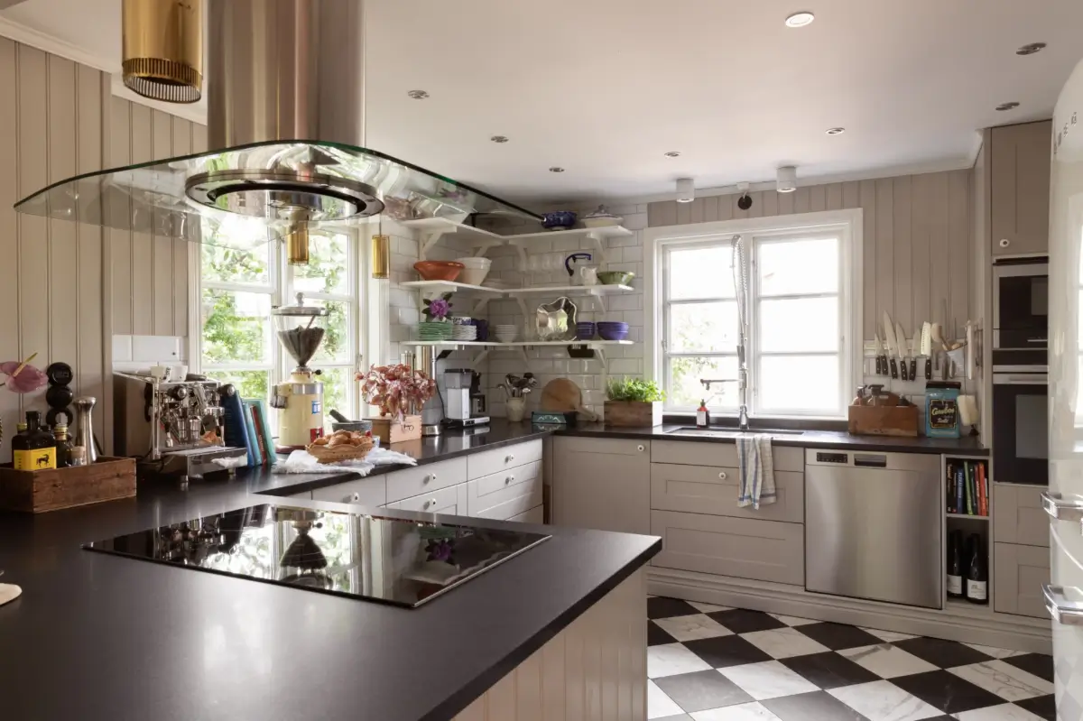 A Renovated 1920s Villa with a Spectacular Garden 5 kitchen tongue and groove paneling checkerboard floor