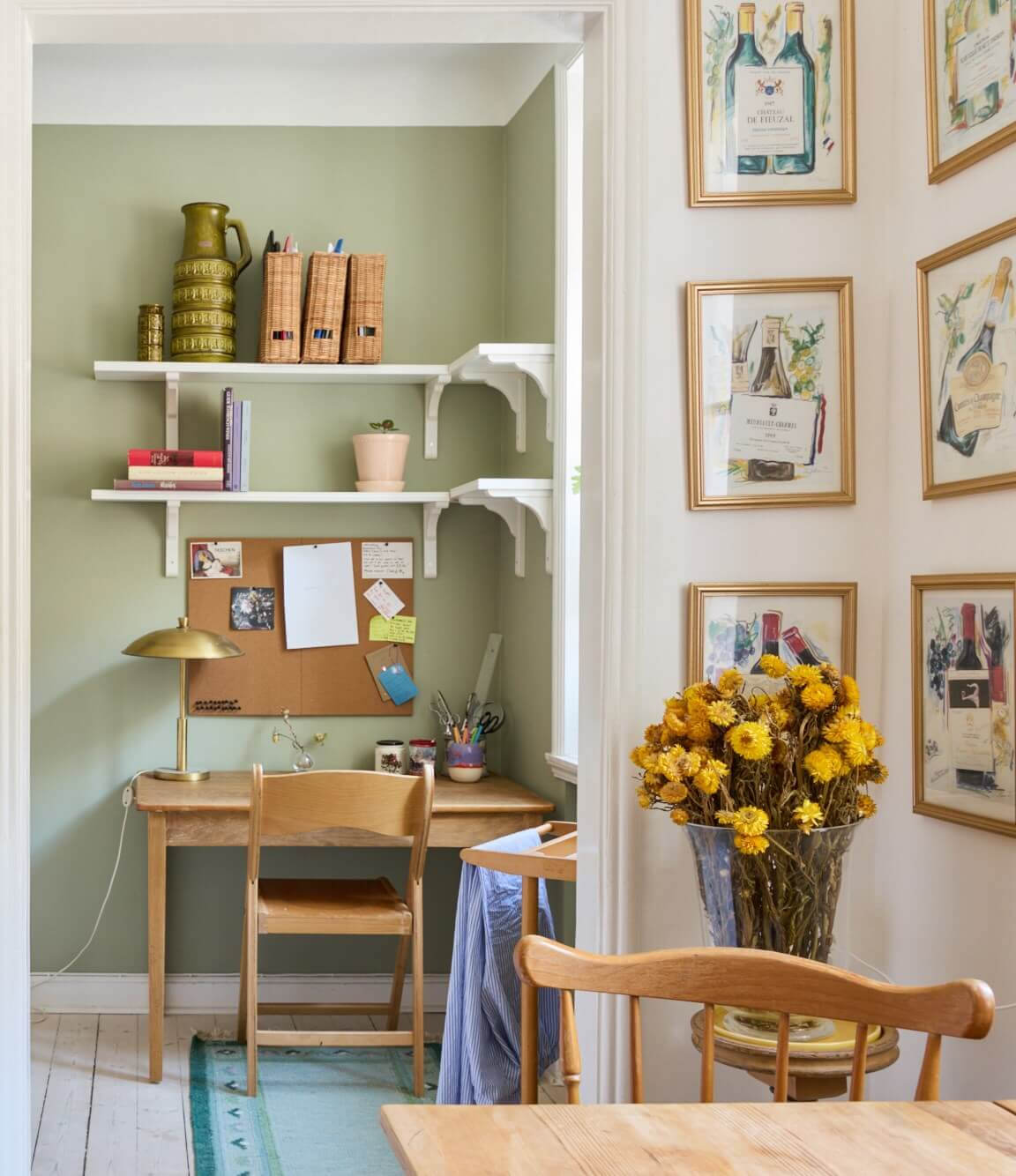A Blue Living Room Filled with Art in a Swedish Apartment 13 kitchen view into bedroom
