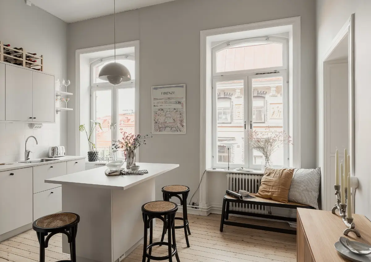 A Gray Scandinavian Apartment with a Royal History 14 kitchen white cabinets small island