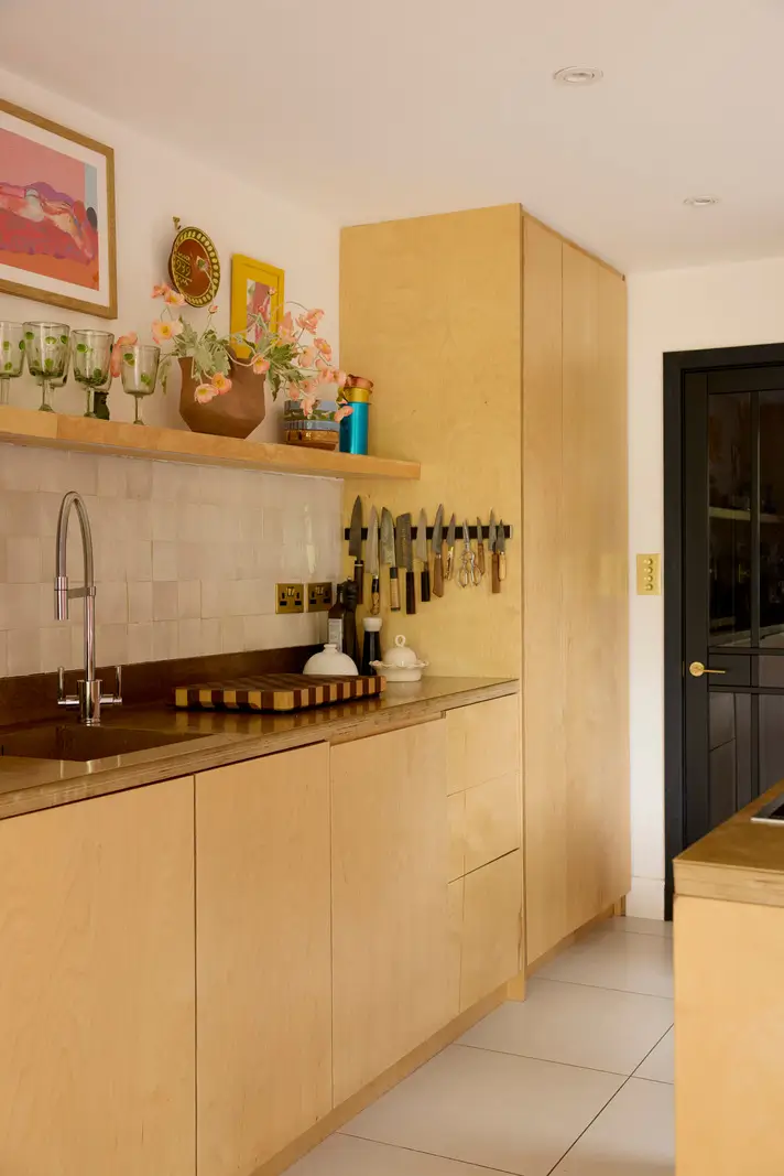 A Victorian Home with a Rich Color Palette and a Lush Garden 7 kitchen with shelf