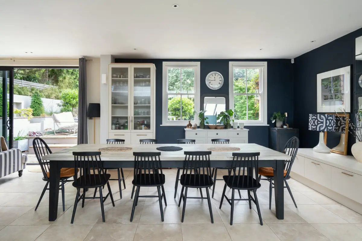Contemporary Open-Plan Living Spaces in an English Victorian House 11 large dining table dark blue walls