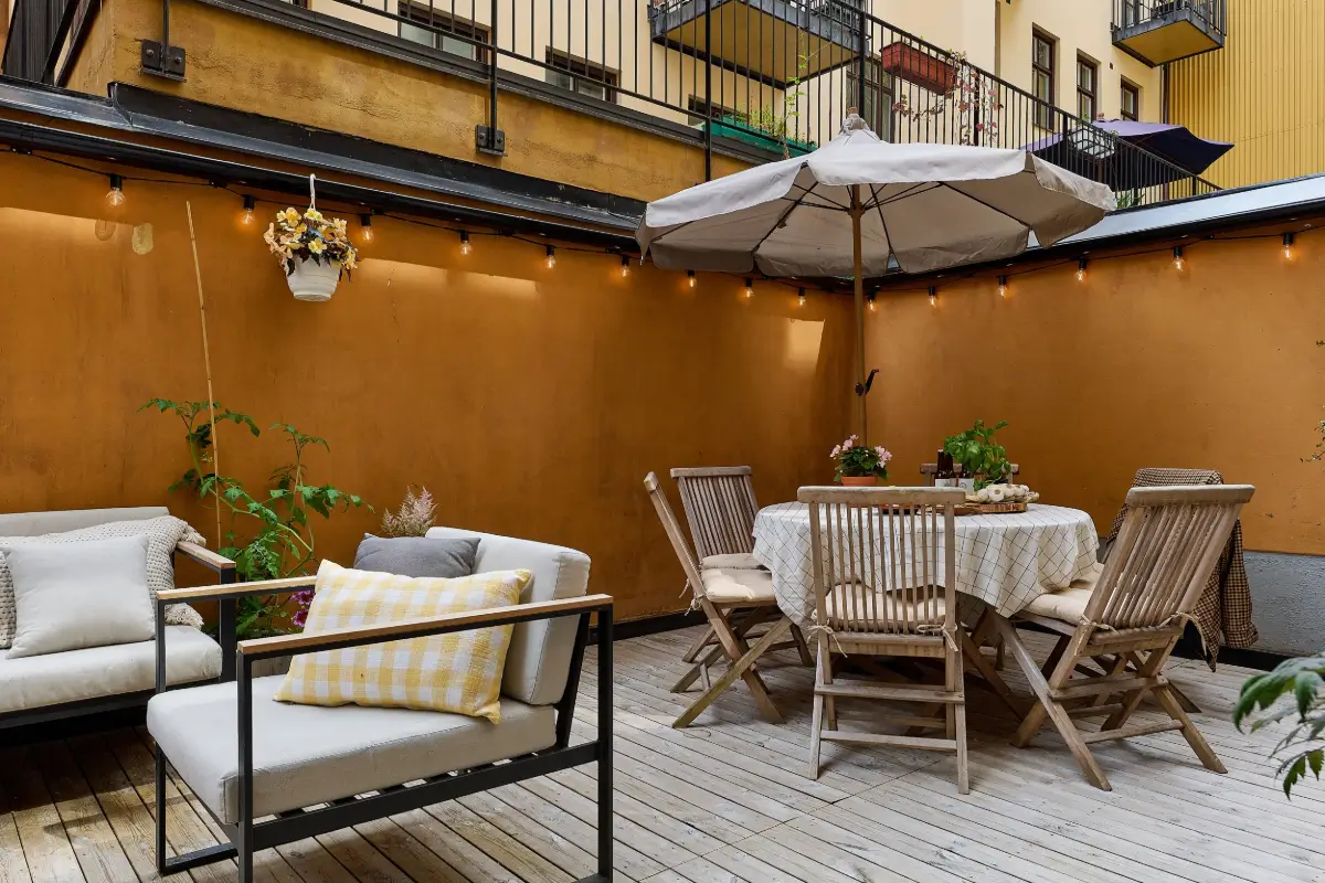 A Colorful Stockholm Apartment with a Large Terrace 26 large terrace with dining table