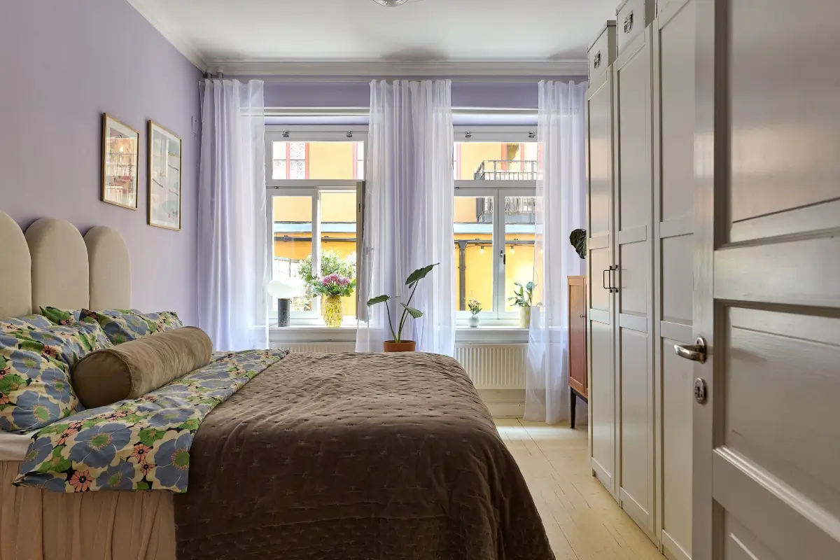 A Colorful Stockholm Apartment with a Large Terrace 14 light blue-purple walls bedroom