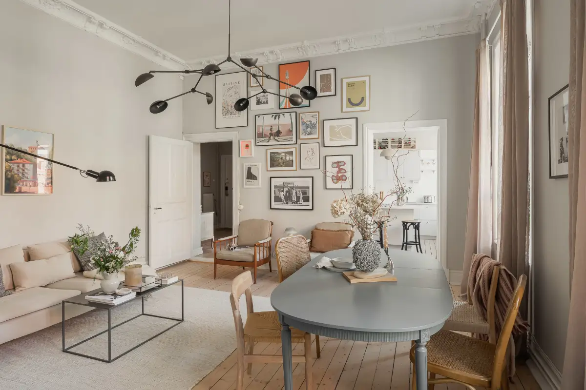 A Gray Scandinavian Apartment with a Royal History 7 light gray living room gallery wall nordroom