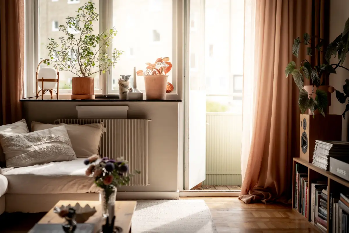An Earthy Color Palette and Exposed Brick in a 1940s Apartment 5 living room balcony