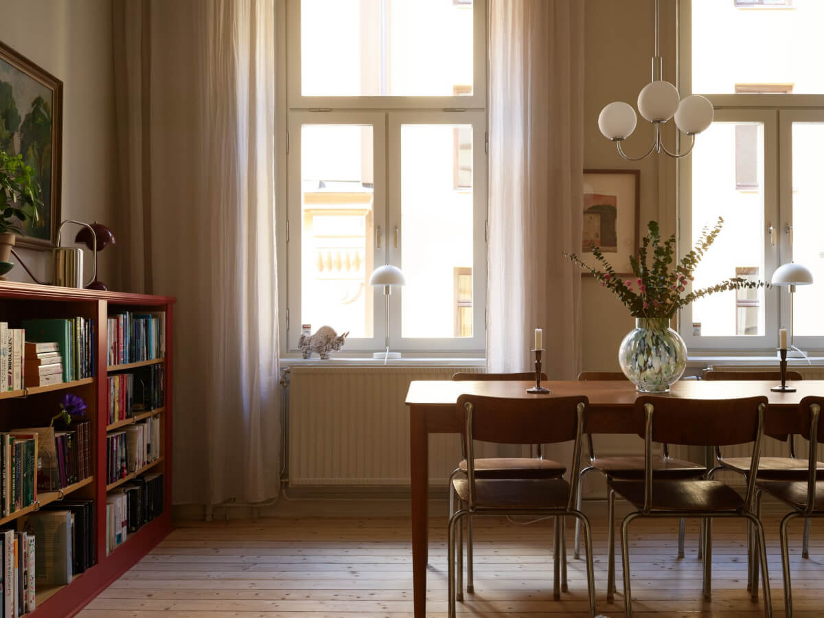 Blue and Red Color Accents in a Stylish Scandinavian Apartment 8 living room detail dining table