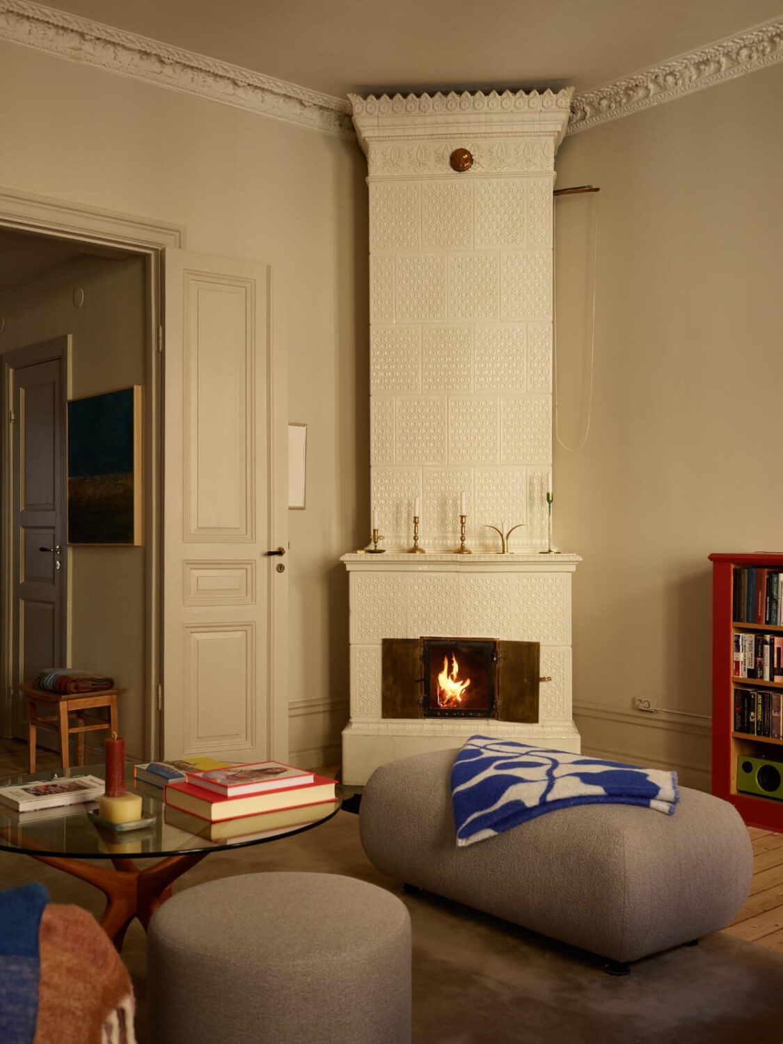 Blue and Red Color Accents in a Stylish Scandinavian Apartment 6 living room fireplace