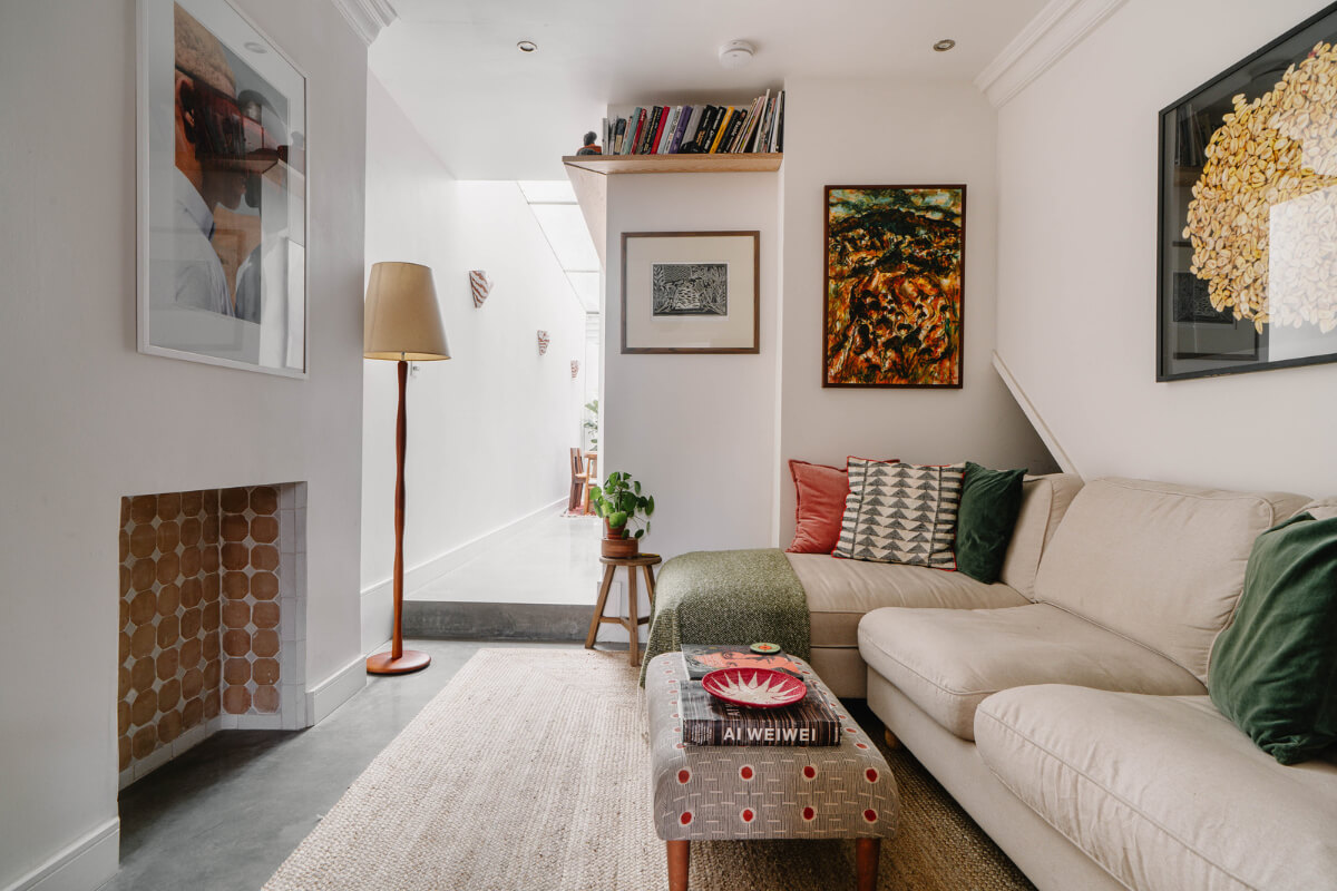 A Modern Ground-Floor Apartment with a Tiny Patio Garden 12 living room fireplace high bookshelf