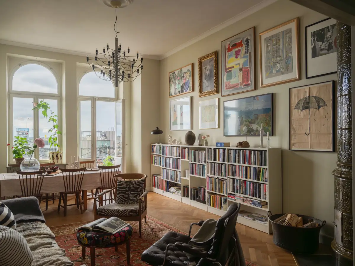 A Classic Late 19th Century Apartment with Magnificent Views of Stockholm 2 living room gallery wall open bookcases
