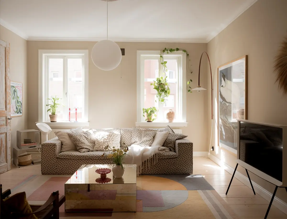 Neutral Shades and Period Elements in a Scandi Apartment 6 living room pastel rug polkadot sofa