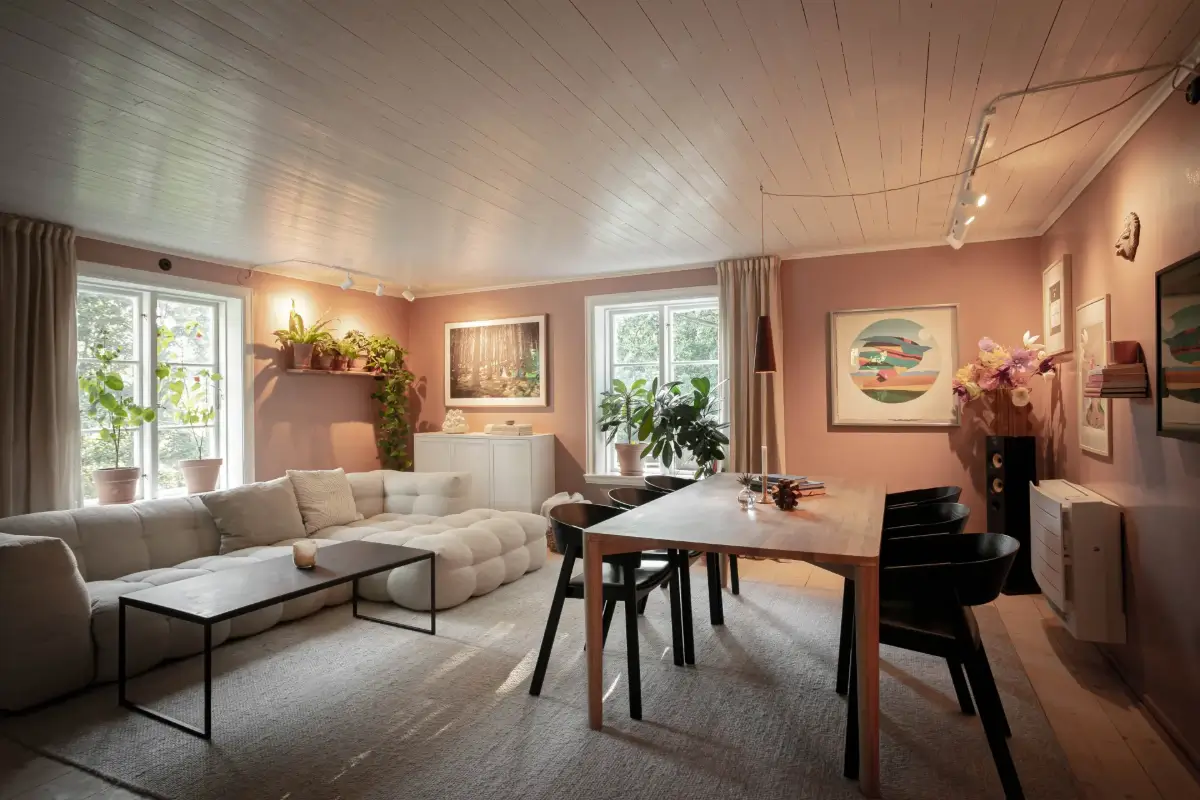 Modern Comforts and Historic Architecture in an 18th Century Home 10 living room pink walls dining table