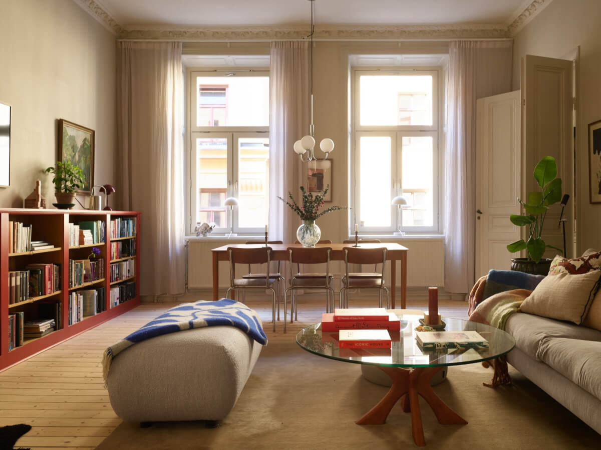 Blue and Red Color Accents in a Stylish Scandinavian Apartment 1 living room red bookcases