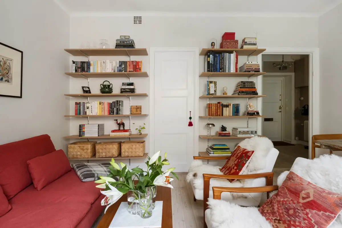 A Red Kitchen in a Small and Light Scandinavian Apartment 8 living room red sofa bookshelves