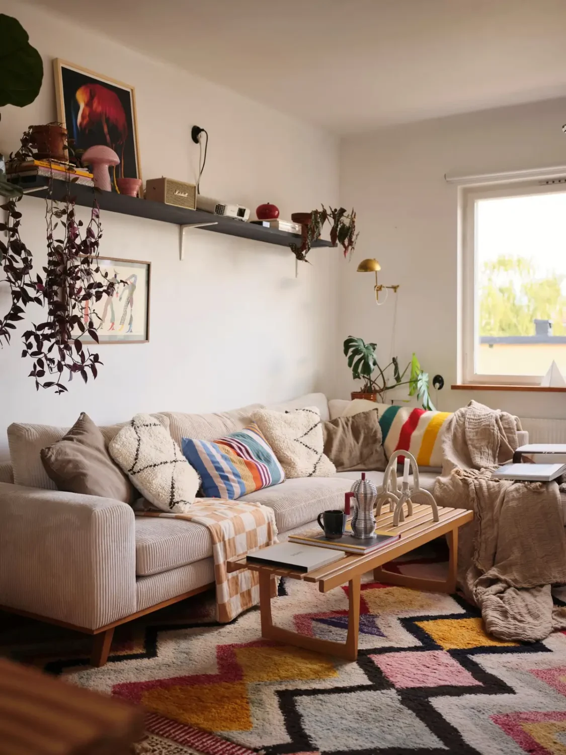 A Pink Bathroom and a Plywood Kitchen in a Stockholm Apartment 13 living room sofa colorful rug