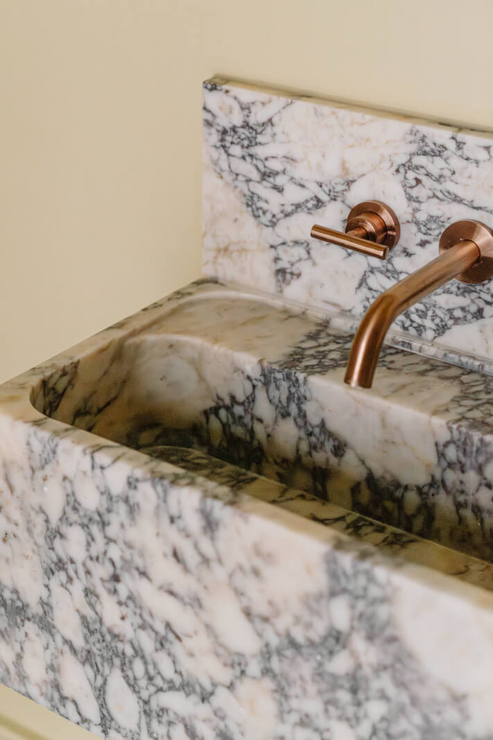 A Modern Ground-Floor Apartment with a Tiny Patio Garden 19 marble sink detail