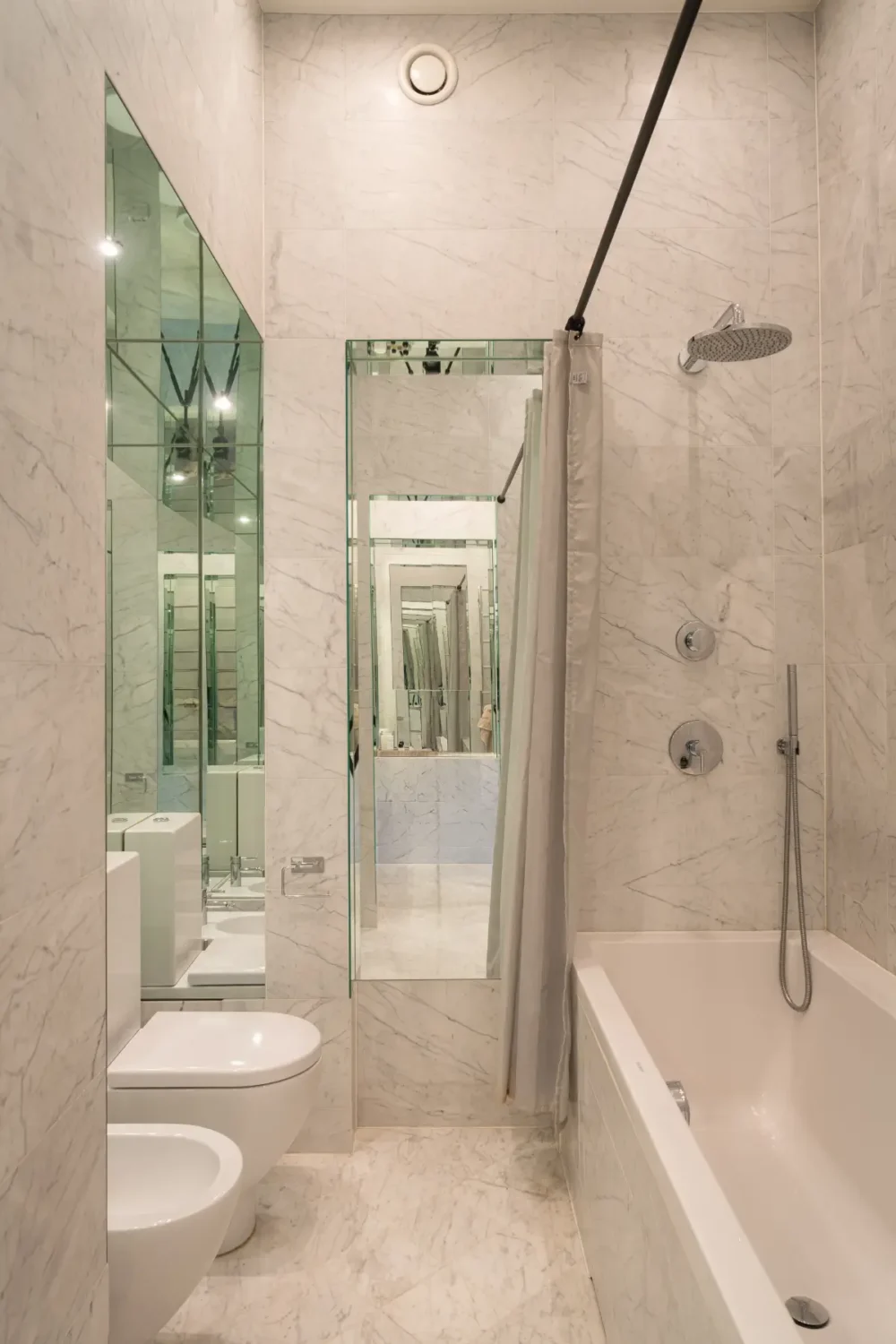 A Classic Stockholm Apartment with a Sky-Blue Kitchen 15 marble tiled bathroom